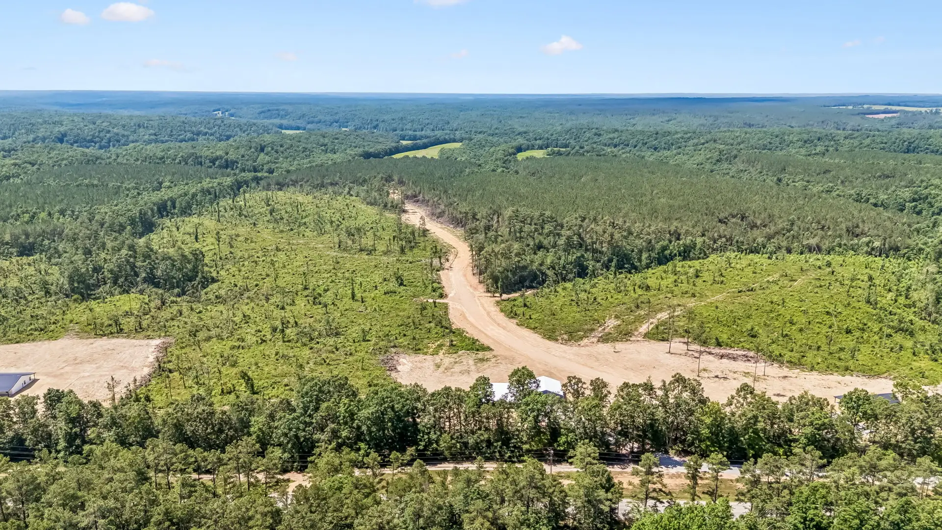 Front aerial view at 1855 Linden Hwy, a barndominium in Hohenwald, Tennessee