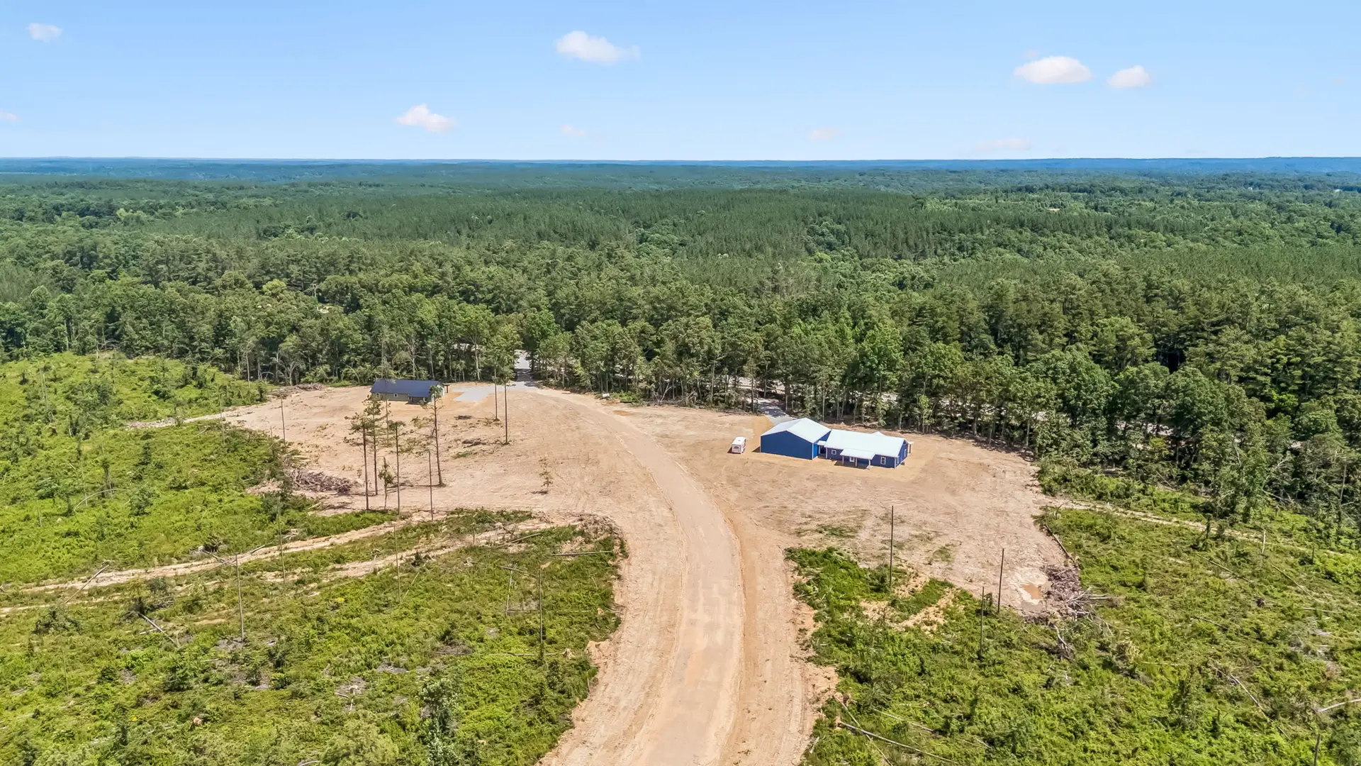 Rear aerial view at 1855 Linden Hwy, a barndominium in Hohenwald, Tennessee