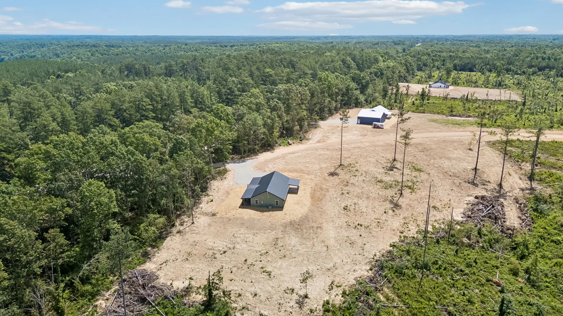Aerial side view at 1919 Linden Hwy, a barndominium in Hohenwald, Tennessee