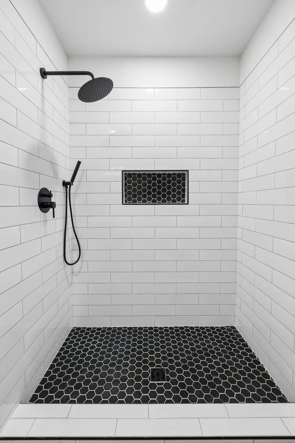 Master bathroom shower vertical at 1919 Linden Hwy, a barndominium in Hohenwald, Tennessee
