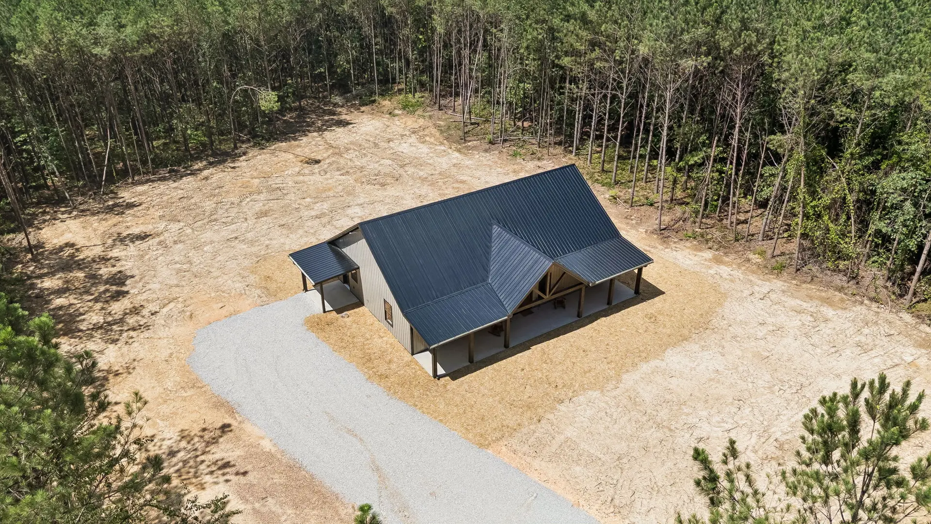 Aerial front view at 1975 Linden Hwy, a barndominium in Hohenwald, Tennessee